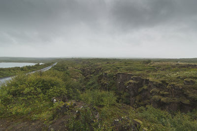 Scenic view of sea against cloudy sky