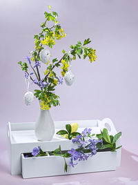 Flowers in vase against white background