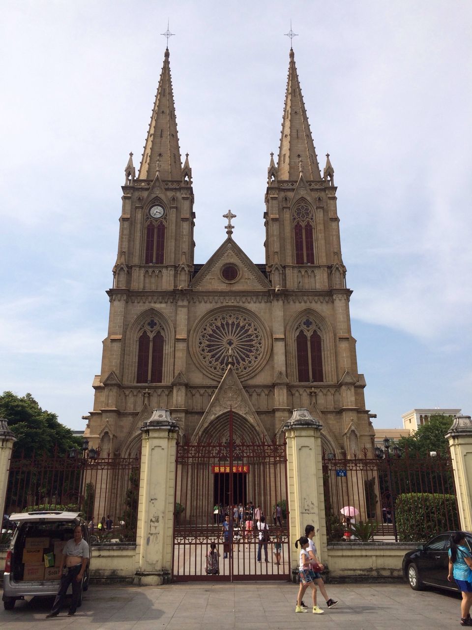 religion, place of worship, architecture, spirituality, church, building exterior, built structure, cathedral, sky, facade, famous place, travel destinations, incidental people, travel, tourism, low angle view, cross