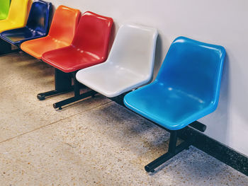 High angle view of empty chair on table