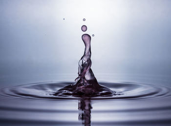 Close-up of water splashing on white background