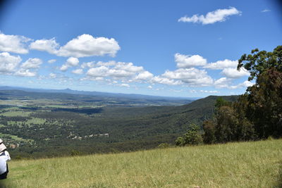 Scenic view of landscape against cloudy sky