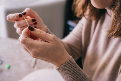 Close-up of woman holding smart phone