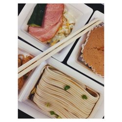 Close-up of asian food in disposable plate