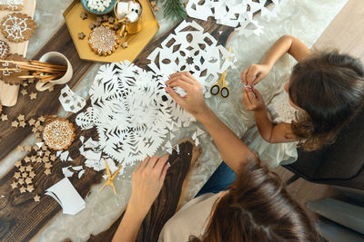 High angle view of people on table