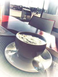 Close-up of coffee cup on table