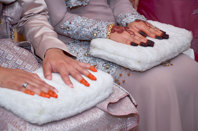 Close-up of woman holding hands