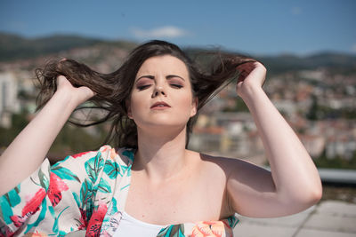 Portrait of beautiful young woman in park