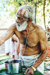 Full length of man with indian priest