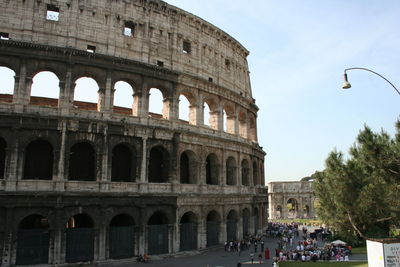 Low angle view of coliseum against sky