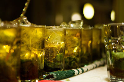 Row of mojitos served on table