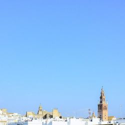 Buildings against blue sky and clouds