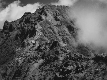 Low angle view of rock formations against sky