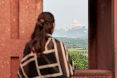 Side view of young woman looking away