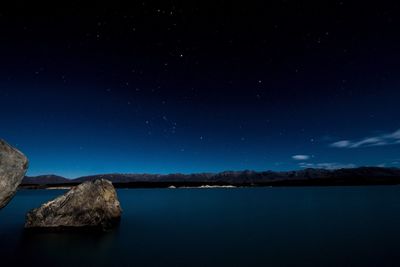 Scenic view of lake against star field