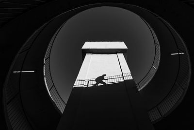 Directly below shot of person walking in building