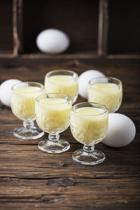 Close-up of advocaat in glasses on table