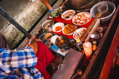 High angle view of man preparing food