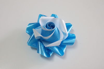 High angle view of blue paper on white background