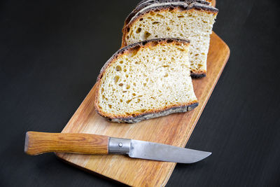 High angle view of bread on cutting board