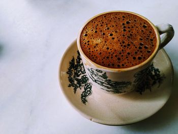 High angle view of coffee cup on table