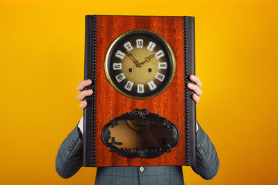 Close-up of clock on wall