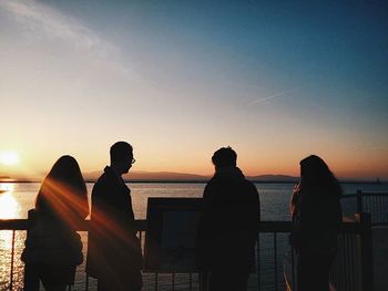 Silhouette of people at sunset