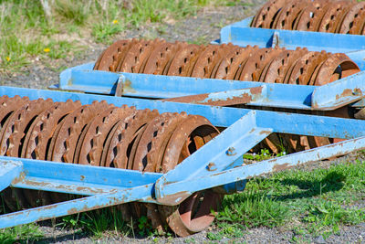 Close-up of rusty metallic structure on field