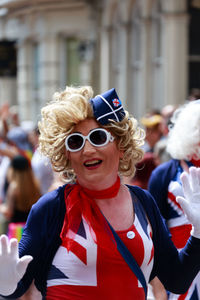 Portrait of smiling woman wearing sunglasses