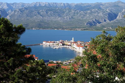 High angle view of townscape by sea