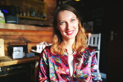 Portrait of smiling young woman at home