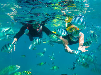People swimming in sea