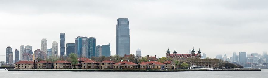 City at waterfront against sky