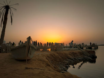 Scenic view of beach against sky during sunset