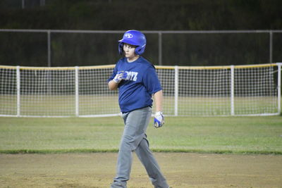 Full length of boy playing on field