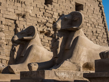 Statue against historic building