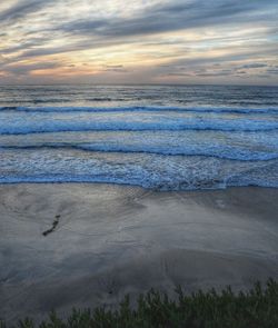 Scenic view of sea at sunset