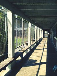 Empty walkway along built structures