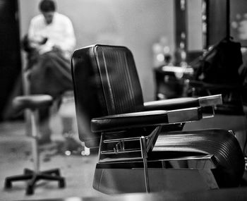 Close-up of empty chairs and table