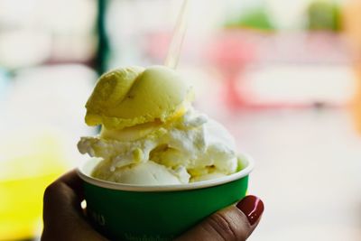 Cropped image of person holding ice cream