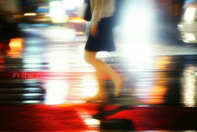 Blurred motion of people walking on road