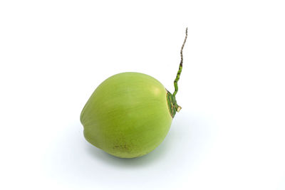 Close-up of fruit against white background