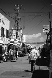 People walking on street in city