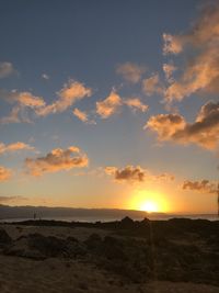 Scenic view of sunset over land