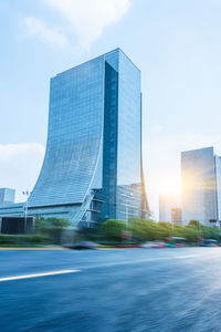 Modern buildings in city against sky