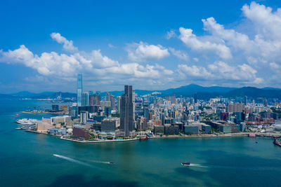 Scenic view of sea and buildings against sky