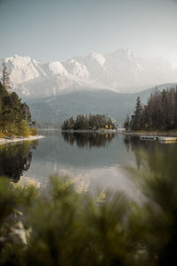 Scenic view of lake and mountains against sky