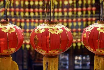 Close-up of red lanterns hanging in market