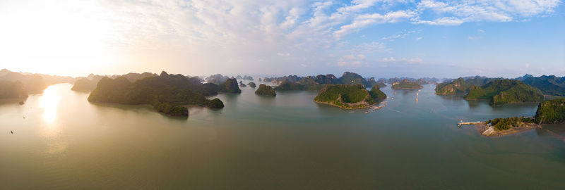 Panoramic view of rocks in water against sky
