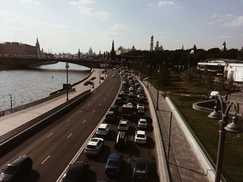 High angle view of street by river against sky